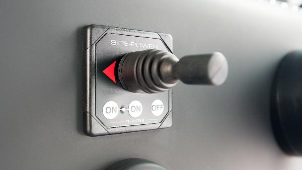 Slide: The Image of Side-Power thruster control on 2024 Axopar 37 XC Cross Cabin Wet Bar. - 9