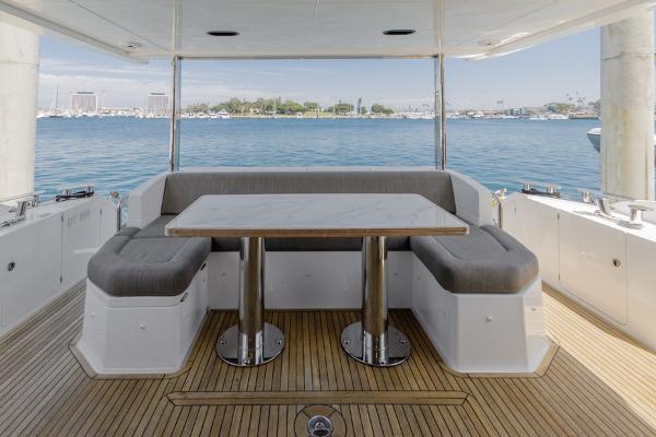 Slide: The Image of Azimut 60 Flybridge 2021 yacht deck with seating and ocean view. - 18