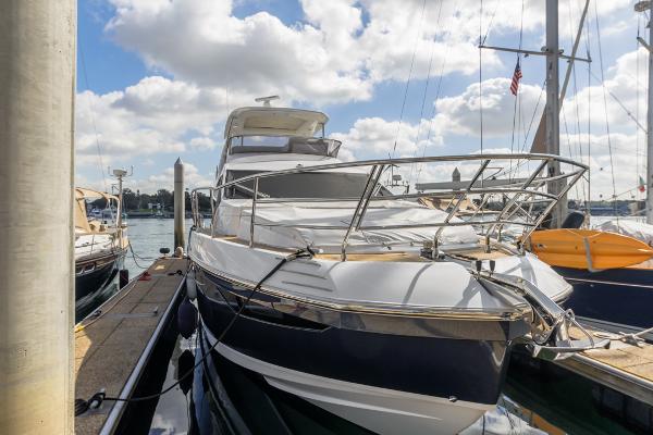 Slide: The Image of Azimut 60 Flybridge 2021 yacht docked under a partly cloudy sky. - 2