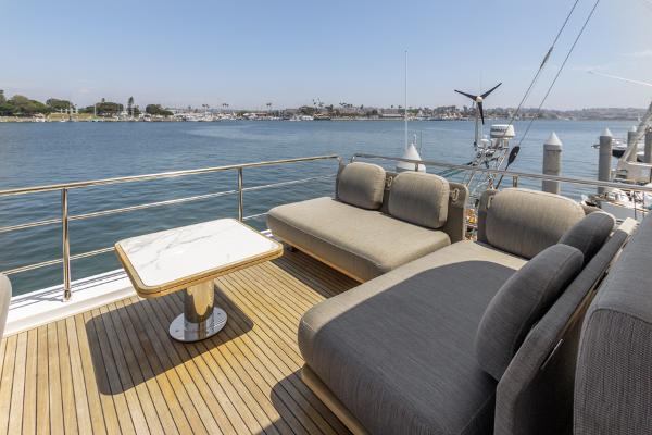 Slide: The Image of Luxurious Azimut 60 Flybridge 2021 yacht deck with elegant seating and scenic water view. - 32