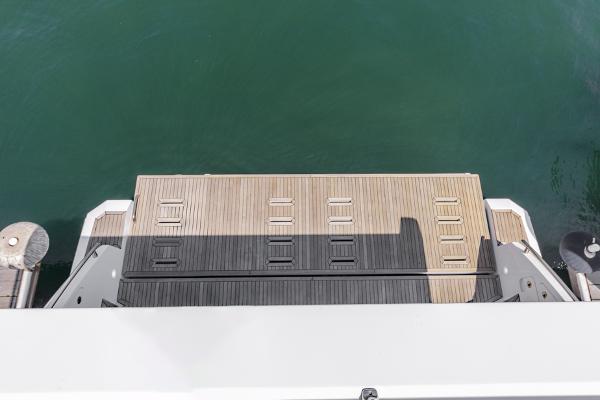 Slide: The Image of Azimut 60 Flybridge 2021 yacht swim platform with teak decking. - 33