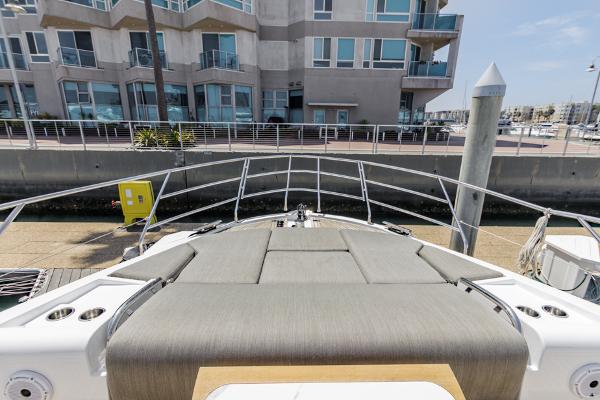 Slide: The Image of Azimut 60 Flybridge 2021 yacht docked near modern waterfront building. - 36