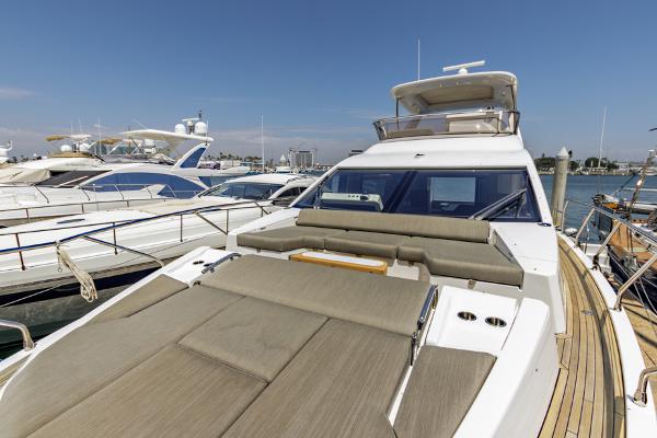 Slide: The Image of Azimut 60 Flybridge 2021 yacht with spacious deck and luxurious seating at marina. - 38