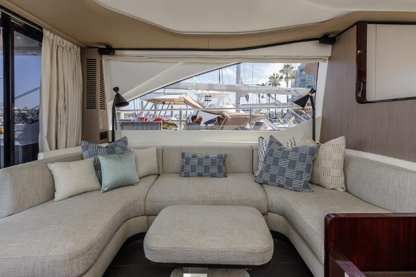 Slide: The Image of Luxurious interior of 2021 Azimut 60 Flybridge yacht with elegant seating and marina view. - 46