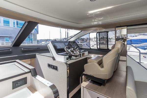 Slide: The Image of Interior of 2021 Azimut 60 Flybridge yacht with modern helm and seating. - 47