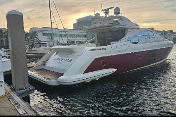 Slide: The Image of 2009 Azimut 68S yacht docked at marina during sunset. - 0