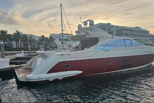 Slide: The Image of 2009 Azimut 68S luxury yacht docked at marina during sunset. - 2