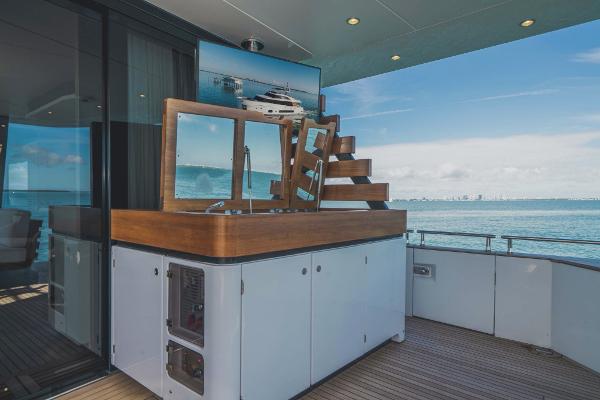 Slide: The Image of Azimut Magellano 25 Metri 2023 yacht deck with outdoor kitchen and ocean view. - 19