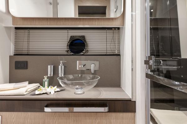 Slide: The Image of Modern bathroom in 2023 Azimut S6 yacht with glass sink and sleek fixtures. - 17