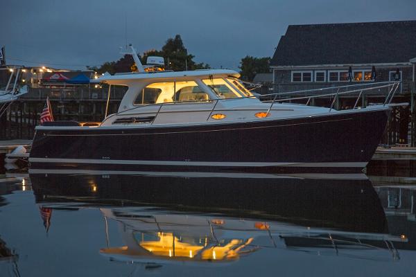 Slide: The Image of Manufacturer Provided Image: 2018 Back Cove 32 yacht docked at night with lights on. - 3