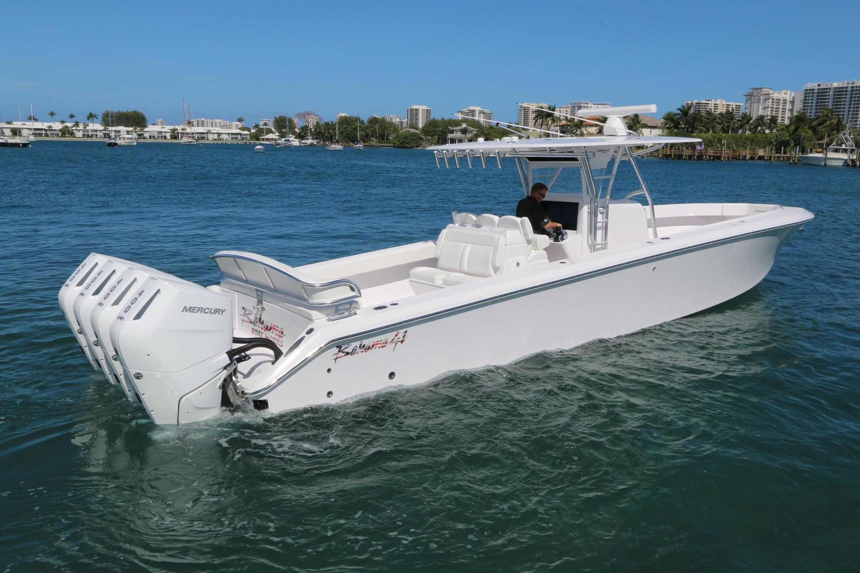 Slide: The Image of 2024 Bahama 41' Open Fisherman boat with triple Mercury engines on the water. - 0