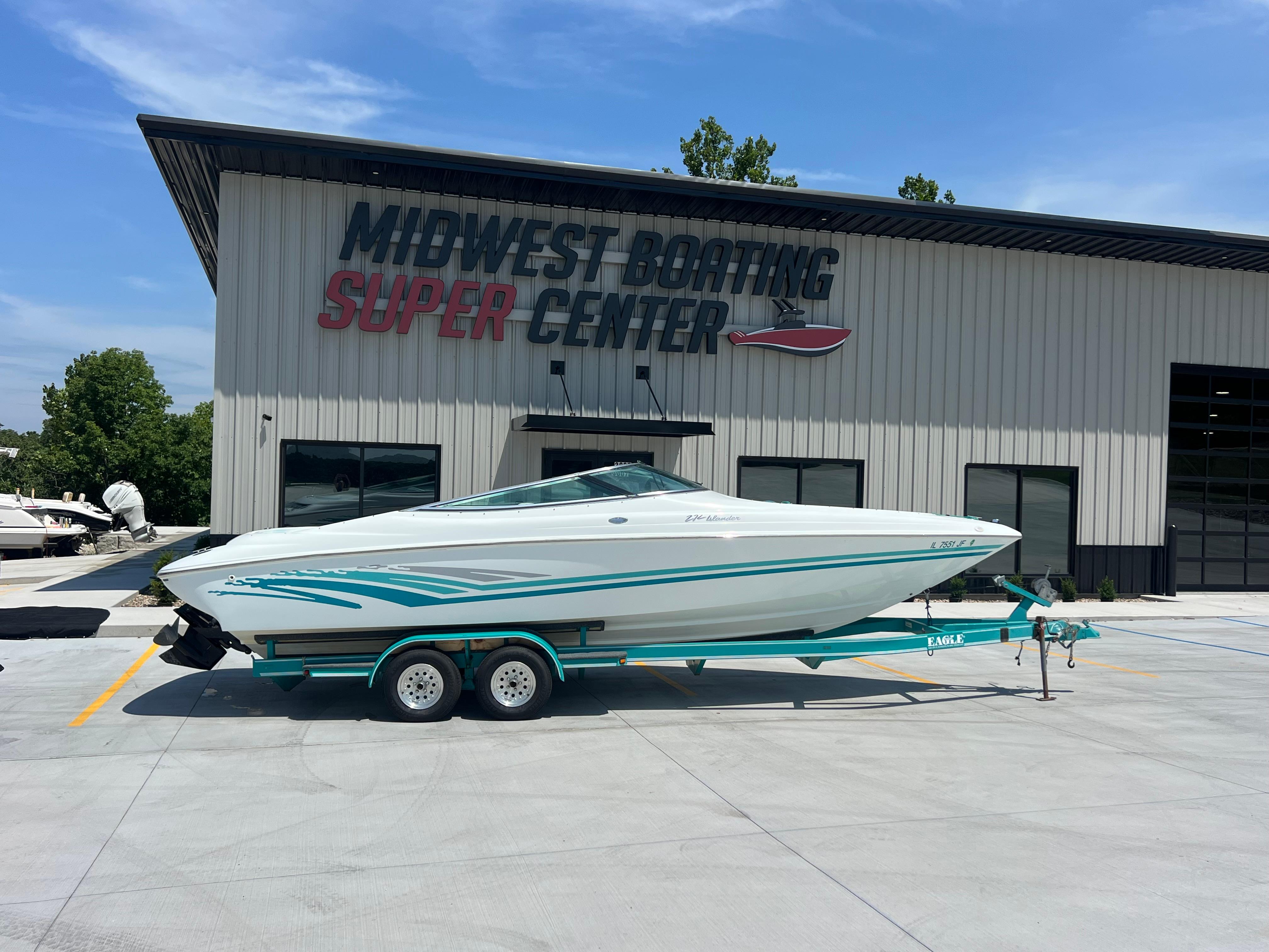 Slide: The Image of 1999 Baja 272 Islander boat on trailer at Midwest Boating Super Center. - 0