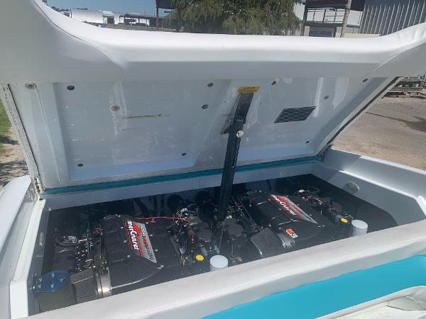 Slide: The Image of 1999 Baja 29 Outlaw SST boat engine compartment with twin MerCruiser engines. - 19