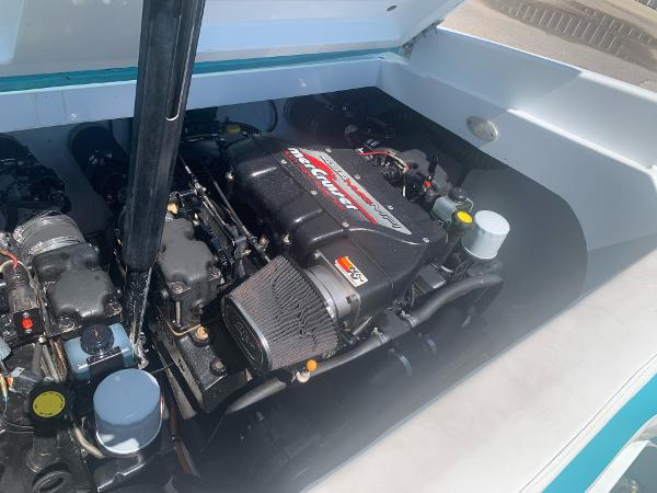 Slide: The Image of 1999 Baja 29 Outlaw SST engine compartment with MerCruiser engine. - 21