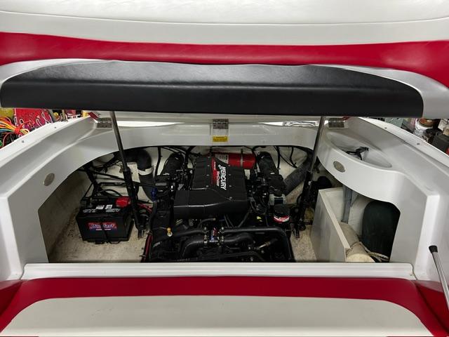 Slide: The Image of Engine compartment of a 2000 Baja H2X boat, featuring a Mercury engine. - 5