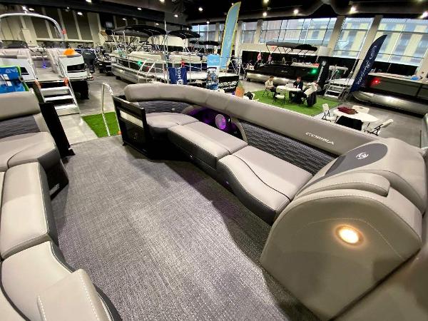 Slide: The Image of 2024 Barletta Corsa Ultra-Lounge 25UCA pontoon boat interior at a boat show. - 13