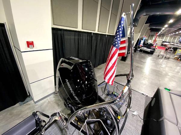 Slide: The Image of 2024 Barletta Corsa Ultra-Lounge 25UCA boat with Mercury engine and American flag. - 9