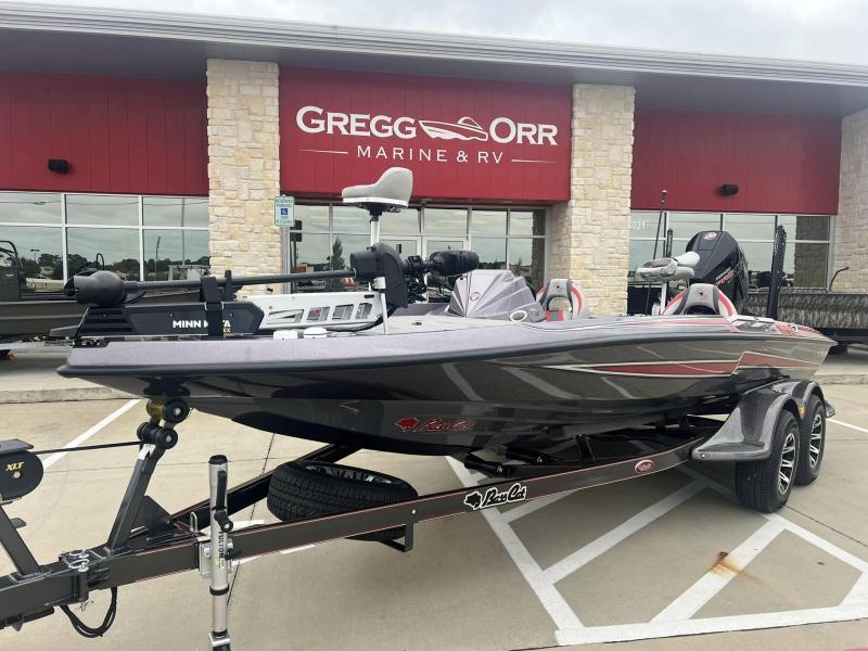 Slide: The Image of 2024 Bass Cat Caracal STS boat on trailer at Gregg Orr Marine & RV dealership. - 1
