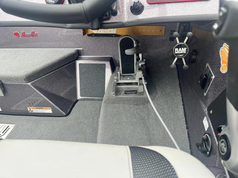 Slide: The Image of 2024 Bass Cat Caracal STS boat interior, featuring steering controls and RAM mount. - 12