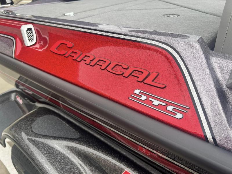 Slide: The Image of 2024 Bass Cat Caracal STS boat, close-up of red and gray exterior detailing. - 13