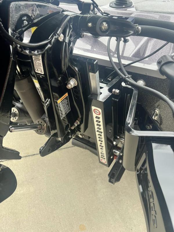 Slide: The Image of Close-up of the 2024 Bass Cat Caracal STS boat's engine mount and hydraulic system. - 17