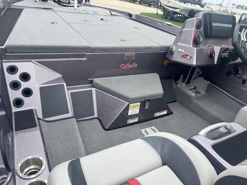 Slide: The Image of 2024 Bass Cat Caracal STS boat interior with Humminbird electronics and ample storage compartments. - 20