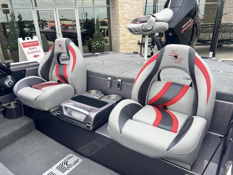 Slide: The Image of 2024 Bass Cat Caracal STS boat interior with red and black seats. - 21