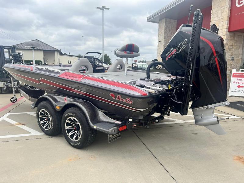 Slide: The Image of 2024 Bass Cat Caracal STS boat with trailer, parked outside dealership. - 3