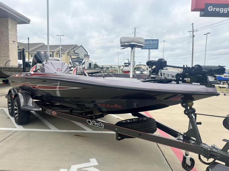 Slide: The Image of 2024 Bass Cat Caracal STS boat on trailer in dealership lot. - 6