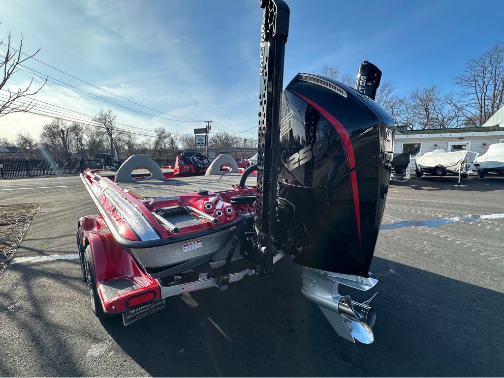 Slide: The Image of 2024 Bass Cat Boats Caracal STS with powerful 250 HP engine, rear view. - 2