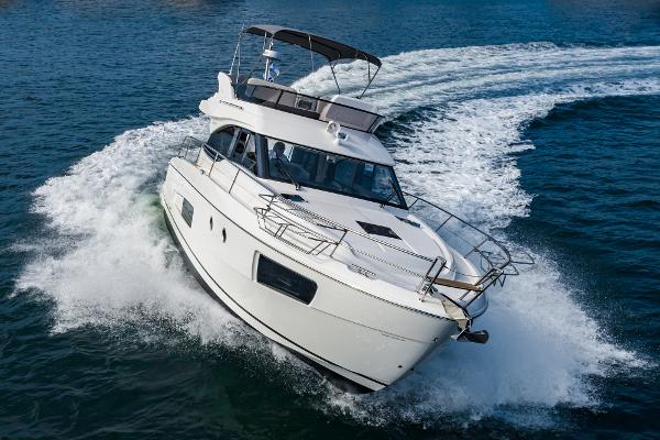 Slide: The Image of Bavaria Virtess 420 Fly 2025 yacht cruising on open water. - 1
