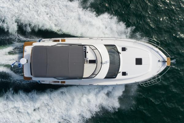 Slide: The Image of Aerial view of 2025 Bavaria Virtess 420 Fly yacht cruising on the ocean. - 10