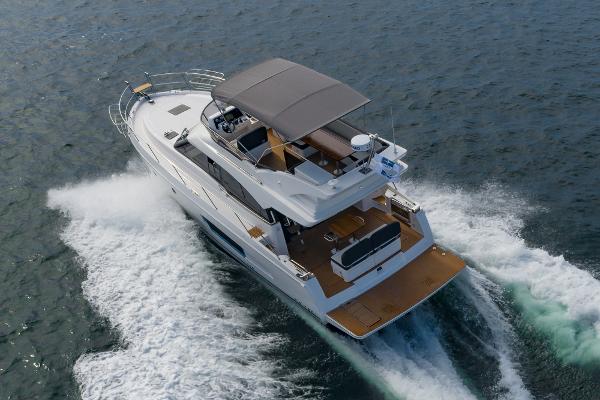 Slide: The Image of 2025 Bavaria Virtess 420 Fly yacht cruising on open water. - 11
