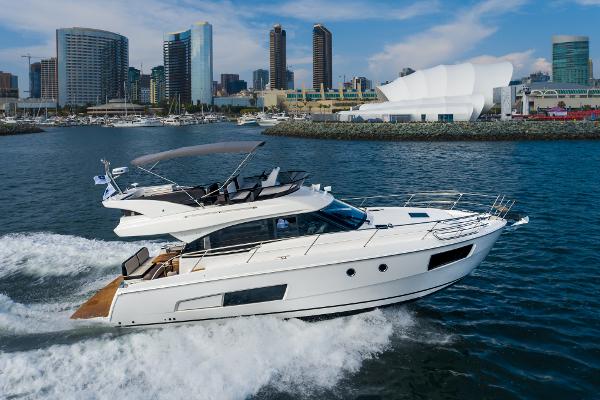 Slide: The Image of 2025 Bavaria Virtess 420 Fly yacht cruising near city skyline. - 13