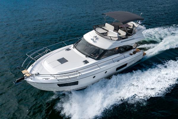Slide: The Image of 2025 Bavaria Virtess 420 Fly yacht cruising on open water. - 2