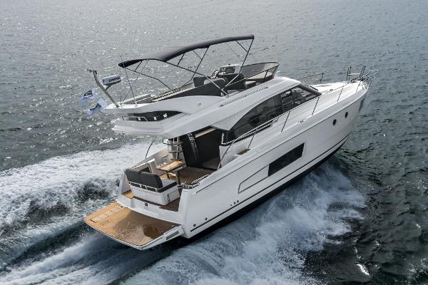 Slide: The Image of 2025 Bavaria Virtess 420 Fly yacht cruising on open water. - 22