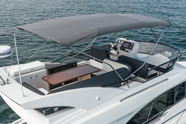 Slide: The Image of 2025 Bavaria Virtess 420 Fly yacht with flybridge and canopy on water. - 23