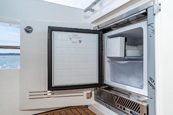 Slide: The Image of Open freezer on Bavaria Virtess 420 Fly yacht, 2025 model, with ice tray visible. - 30