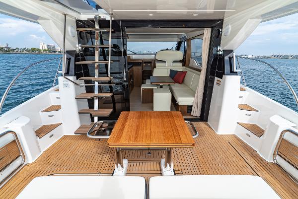 Slide: The Image of Luxurious 2025 Bavaria Virtess 420 Fly yacht interior with elegant seating and wooden table. - 37