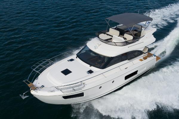 Slide: The Image of 2025 Bavaria Virtess 420 Fly yacht cruising on open water. - 7