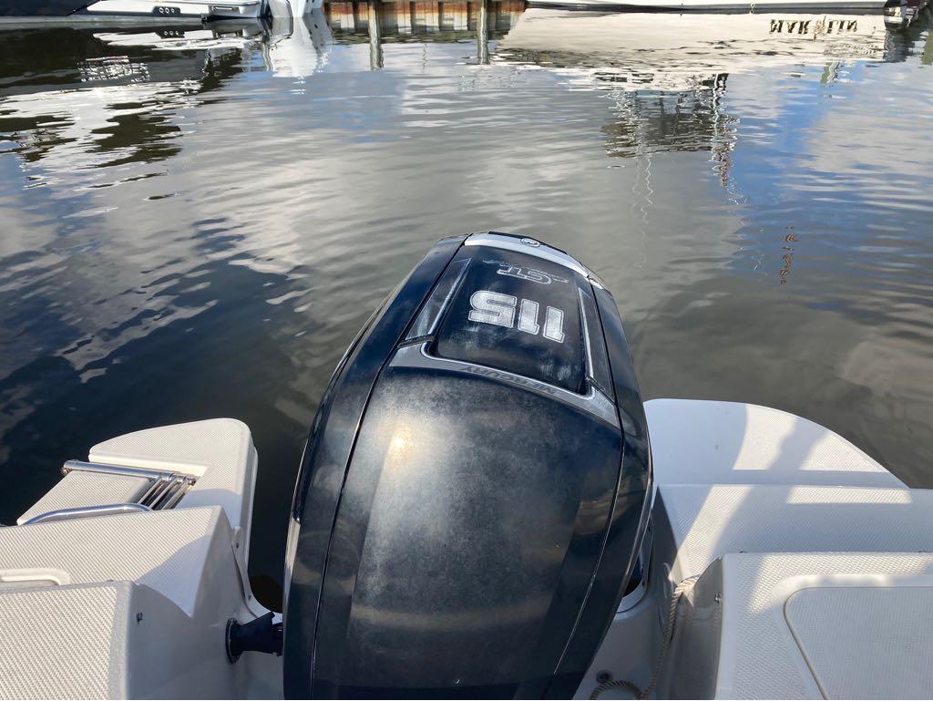 Slide: The Image of 2017 Bayliner 190 boat with outboard motor on calm water. - 10