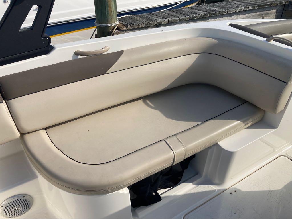 Slide: The Image of 2017 Bayliner 190 boat with beige cushioned seating. - 8