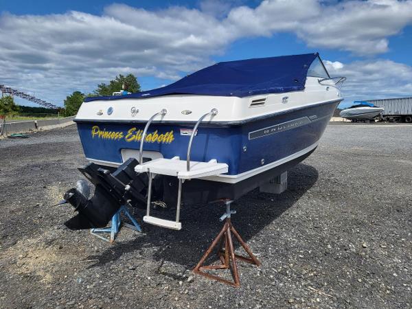 Slide: The Image of 2006 Bayliner 192 Discovery boat on land, blue cover, labeled "Princess Elizabeth." - 15