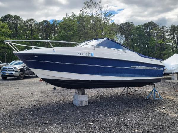 Slide: The Image of 2006 Bayliner 192 Discovery boat on stands in outdoor setting. - 16