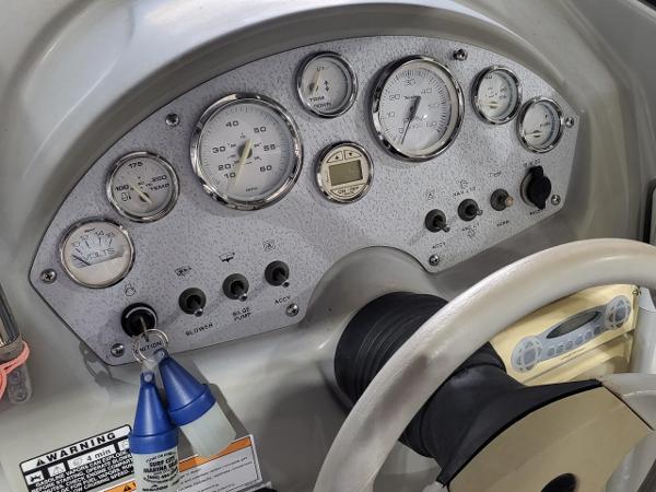 Slide: The Image of Dashboard of a 2006 Bayliner 192 Discovery boat with gauges and controls. - 20