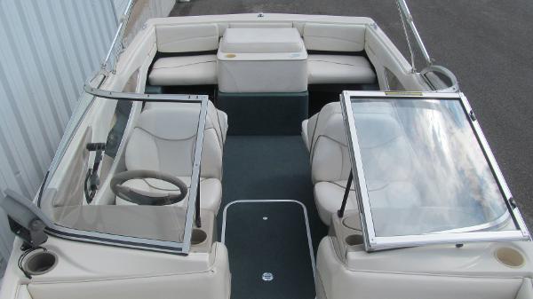 Slide: The Image of 2000 Bayliner 1950 Capri DX boat interior with seating and steering wheel. - 10