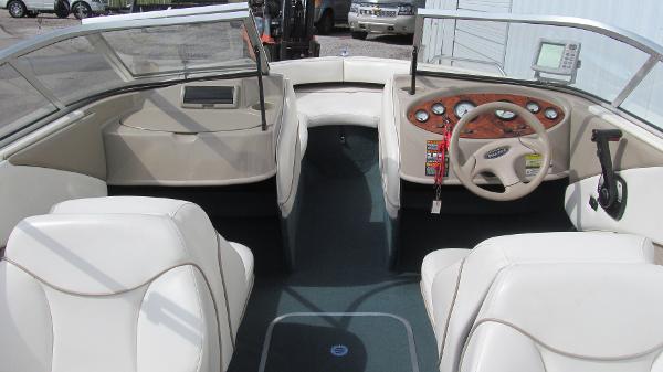 Slide: The Image of 2000 Bayliner 1950 Capri DX boat interior with steering wheel and dashboard controls. - 4