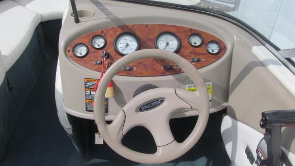 Slide: The Image of Dashboard of 2000 Bayliner 1950 Capri DX boat with gauges and steering wheel. - 6