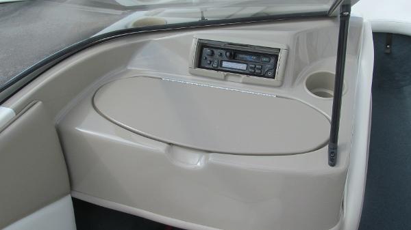 Slide: The Image of Interior of 2000 Bayliner 1950 Capri DX boat with stereo system and storage compartment. - 7