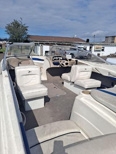 Slide: The Image of 2003 Bayliner 205 Olympic Edition boat interior with seating and steering wheel. - 11